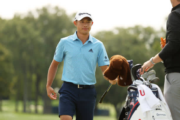 MAMARONECK, NEW YORK - SEPTEMBER 15: Collin Morikawa of the United States hands off his club to his caddie during a practice round prior to the 120th U.S. Open Championship on September 15, 2020 at Winged Foot Golf Club in Mamaroneck, New York. (Photo by Gregory Shamus/Getty Images)