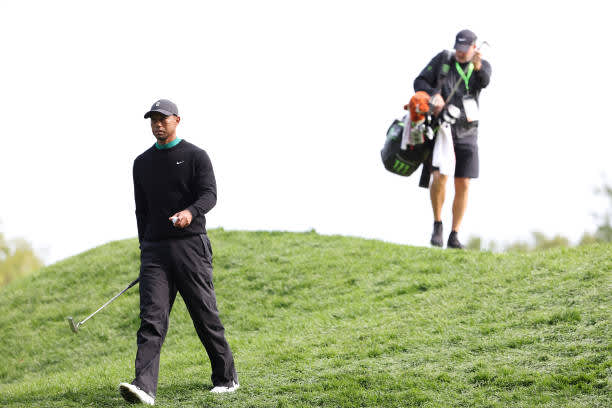 MAMARONECK, NEW YORK - SEPTEMBER 15: Tiger Woods of the United States walks off a green followed by caddie Joe LaCava during a practice round prior to the 120th U.S. Open Championship on September 15, 2020 at Winged Foot Golf Club in Mamaroneck, New York. (Photo by Jamie Squire/Getty Images)