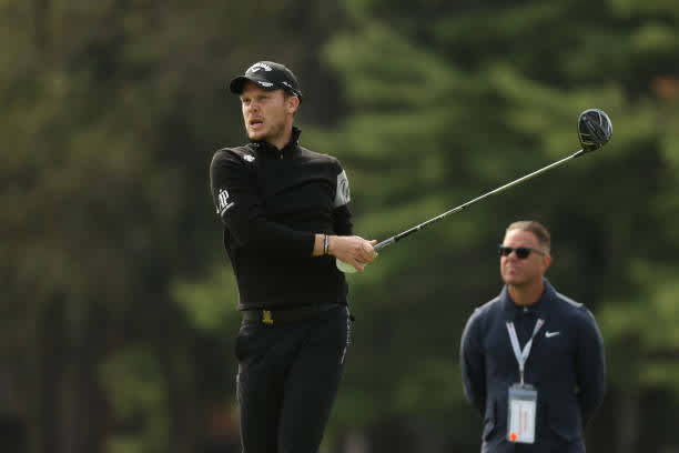 MAMARONECK, NEW YORK - SEPTEMBER 15: Danny Willett of England plays a tee shot as golf instructor Sean Foley looks on during a practice round prior to the 120th U.S. Open Championship on September 15, 2020 at Winged Foot Golf Club in Mamaroneck, New York. (Photo by Gregory Shamus/Getty Images)