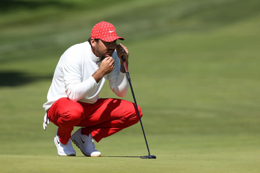 All eyes on Jason Day of Australia. He is matching his cap with a white longsleeve and his red pants.