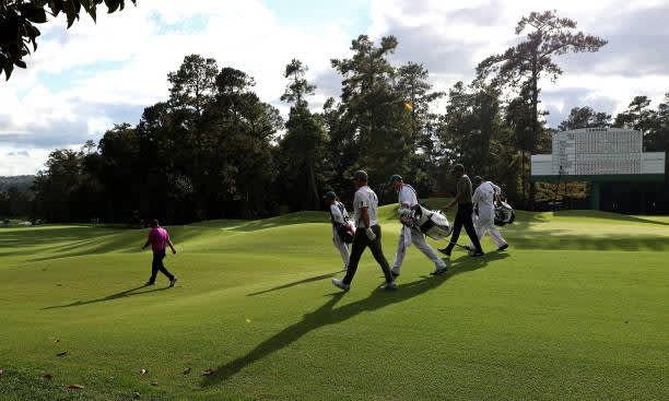 AUGUSTA, GEORGIA - NOVEMBER 12: Paul Casey of England, Patrick Reed of the United States and Tony Finau of the United States walk off the ninth tee during the first round of the Masters at Augusta National Golf Club on November 12, 2020 in Augusta, Georgia. (Photo by Rob Carr/Getty Images)