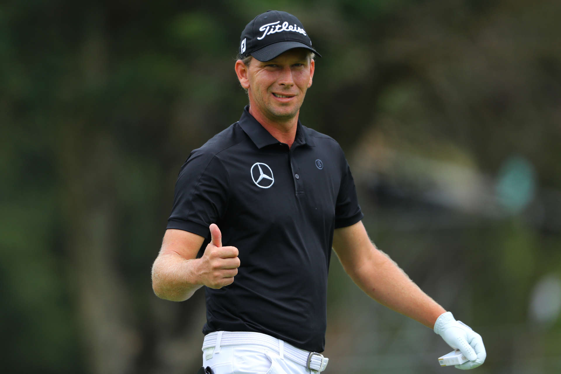 SUN CITY, SOUTH AFRICA - DECEMBER 06: Marcel Siem of Germany gives a thumbs up on the 1st hole during the final round of the South African Open at Gary Player CC on December 6, 2020 in Sun City, South Africa. (Photo by Warren Little/Getty Images)
