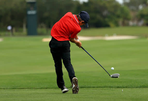 ORLANDO, FLORIDA - DECEMBER 20: Tiger Woods of the United States' son Charlie Woods hits his tee shot on the 16th hole during the final round of the PNC Championship at the Ritz Carlton Golf Club on December 20, 2020 in Orlando, Florida. (Photo by Mike Ehrmann/Getty Images)