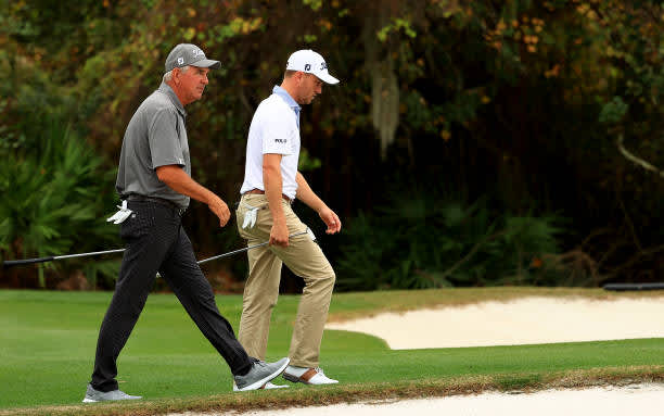 ORLANDO, FLORIDA - DECEMBER 20: Mike Thomas and son Justin Thomas of the United States walk up the 15th hole during the final round of the PNC Championship at the Ritz Carlton Golf Club on December 20, 2020 in Orlando, Florida. (Photo by Mike Ehrmann/Getty Images)