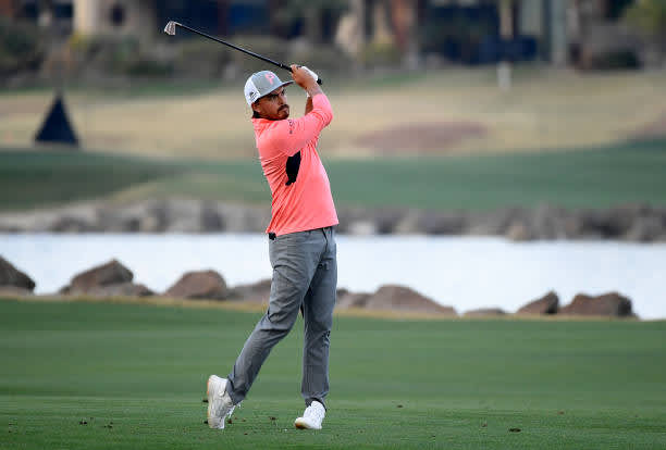 LA QUINTA, CALIFORNIA - JANUARY 22: Rickie Fowler plays his second shot on the 18th hole during the second round of The American Express tournament on the Stadium course at PGA West on January 22, 2021 in La Quinta, California. (Photo by Harry How/Getty Images)