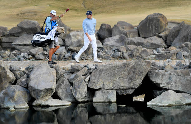 LA QUINTA, CALIFORNIA - JANUARY 22: Patrick Cantlay walks across the bridge on the 17th hole during the second round of The American Express tournament on the Stadium course at PGA West on January 22, 2021 in La Quinta, California. (Photo by Harry How/Getty Images)