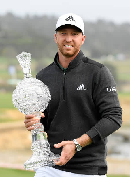PEBBLE BEACH, CALIFORNIA - FEBRUARY 14: Daniel Berger of the United States celebrates with the trophy after winning during the final round of the AT&T Pebble Beach Pro-Am at Pebble Beach Golf Links on February 14, 2021 in Pebble Beach, California. (Photo by Harry How/Getty Images)