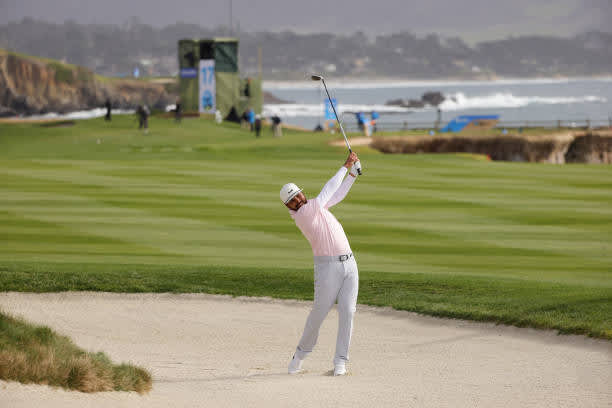 PEBBLE BEACH, CALIFORNIA - FEBRUARY 14: Jason Day of Australia plays his second shot on the 18th hole during the final round of the AT&T Pebble Beach Pro-Am at Pebble Beach Golf Links on February 14, 2021 in Pebble Beach, California. (Photo by Ezra Shaw/Getty Images)