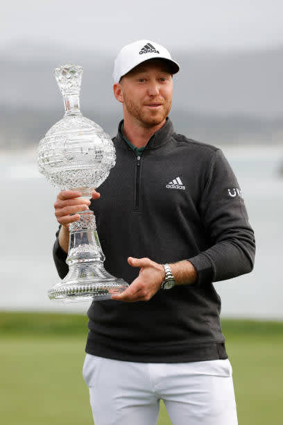 PEBBLE BEACH, CALIFORNIA - FEBRUARY 14: Daniel Berger of the United States celebrates with the trophy after winning during the final round of the AT&T Pebble Beach Pro-Am at Pebble Beach Golf Links on February 14, 2021 in Pebble Beach, California. (Photo by Ezra Shaw/Getty Images)