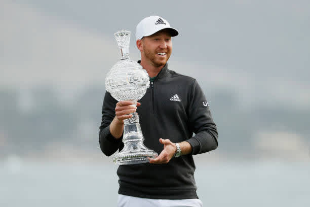 PEBBLE BEACH, CALIFORNIA - FEBRUARY 14: Daniel Berger of the United States celebrates with the trophy after winning during the final round of the AT&T Pebble Beach Pro-Am at Pebble Beach Golf Links on February 14, 2021 in Pebble Beach, California. (Photo by Steph Chambers/Getty Images)