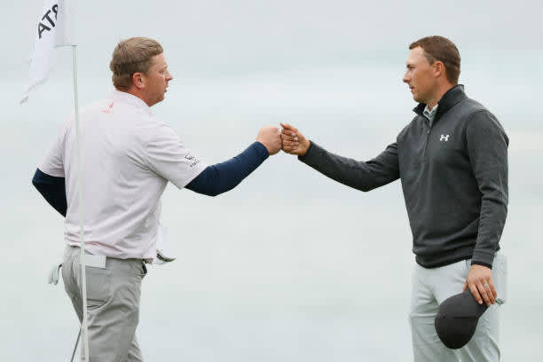PEBBLE BEACH, CALIFORNIA - FEBRUARY 14: Nate Lashley of the United States and Jordan Spieth of the United States bump fists after finishing on the 18th green during the final round of the AT&T Pebble Beach Pro-Am at Pebble Beach Golf Links on February 14, 2021 in Pebble Beach, California. (Photo by Steph Chambers/Getty Images)