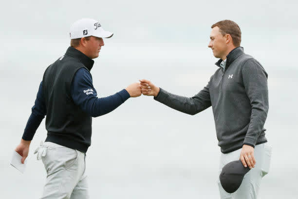 PEBBLE BEACH, CALIFORNIA - FEBRUARY 14: Tom Hoge of the United States and Jordan Spieth of the United States bump fists after finishing on the 18th green during the final round of the AT&T Pebble Beach Pro-Am at Pebble Beach Golf Links on February 14, 2021 in Pebble Beach, California. (Photo by Steph Chambers/Getty Images)