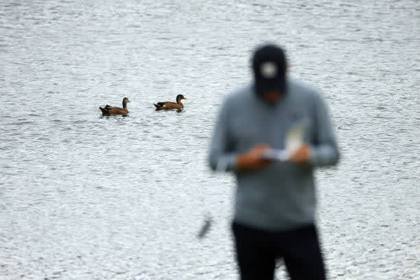 ORLANDO, FLORIDA - MARCH 06: Jordan Spieth of the United States stands on the 18th green as ducks float on the water during the third round of the Arnold Palmer Invitational Presented by MasterCard at the Bay Hill Club and Lodge on March 06, 2021 in Orlando, Florida. (Photo by Mike Ehrmann/Getty Images)