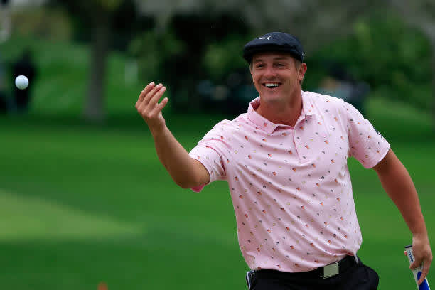 ORLANDO, FLORIDA - MARCH 06: Bryson DeChambeau of the United States smiles as he tosses his golf ball on the 16th hole during the third round of the Arnold Palmer Invitational Presented by MasterCard at the Bay Hill Club and Lodge on March 06, 2021 in Orlando, Florida. (Photo by Sam Greenwood/Getty Images)