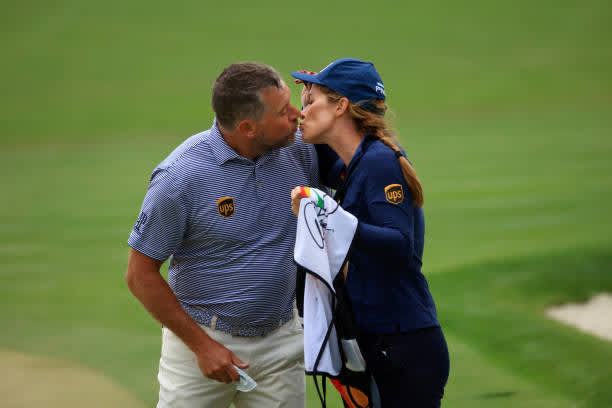 ORLANDO, FLORIDA - MARCH 06: Lee Westwood of England kisses his caddie and girlfriend Helen Storey on the 18th hole during the third round of the Arnold Palmer Invitational Presented by MasterCard at the Bay Hill Club and Lodge on March 06, 2021 in Orlando, Florida. (Photo by Mike Ehrmann/Getty Images)
