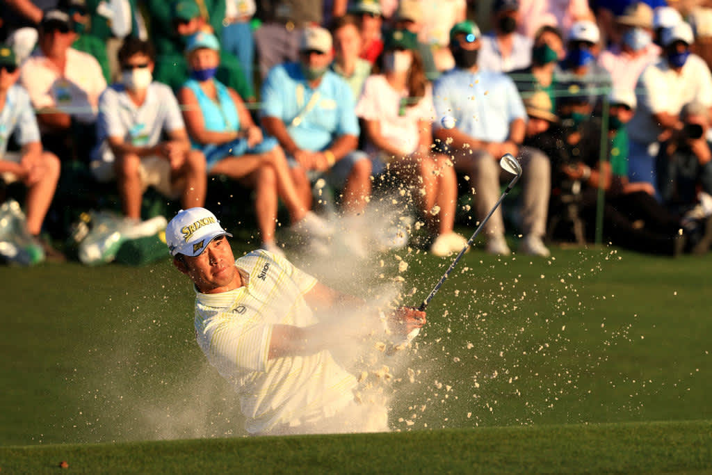 AUGUSTA, GEORGIA - APRIL 11: Hideki Matsuyama of Japan plays a shot from a bunker on the 18th hole during the final round of the Masters at Augusta National Golf Club on April 11, 2021 in Augusta, Georgia. (Photo by Mike Ehrmann/Getty Images)