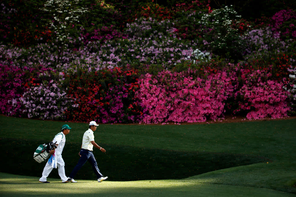 AUGUSTA, GEORGIA - APRIL 11: Hideki Matsuyama of Japan and his caddie, Shota Hayafuji, walk to the 13th green during the final round of the Masters at Augusta National Golf Club on April 11, 2021 in Augusta, Georgia. (Photo by Jared C. Tilton/Getty Images)