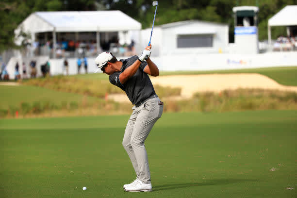 RIDGELAND, SOUTH CAROLINA - JUNE 13: Garrick Higgo of South Africa plays his shot on the 18th hole during the final round of the Palmetto Championship at Congaree on June 13, 2021 in Ridgeland, South Carolina. (Photo by Mike Ehrmann/Getty Images)