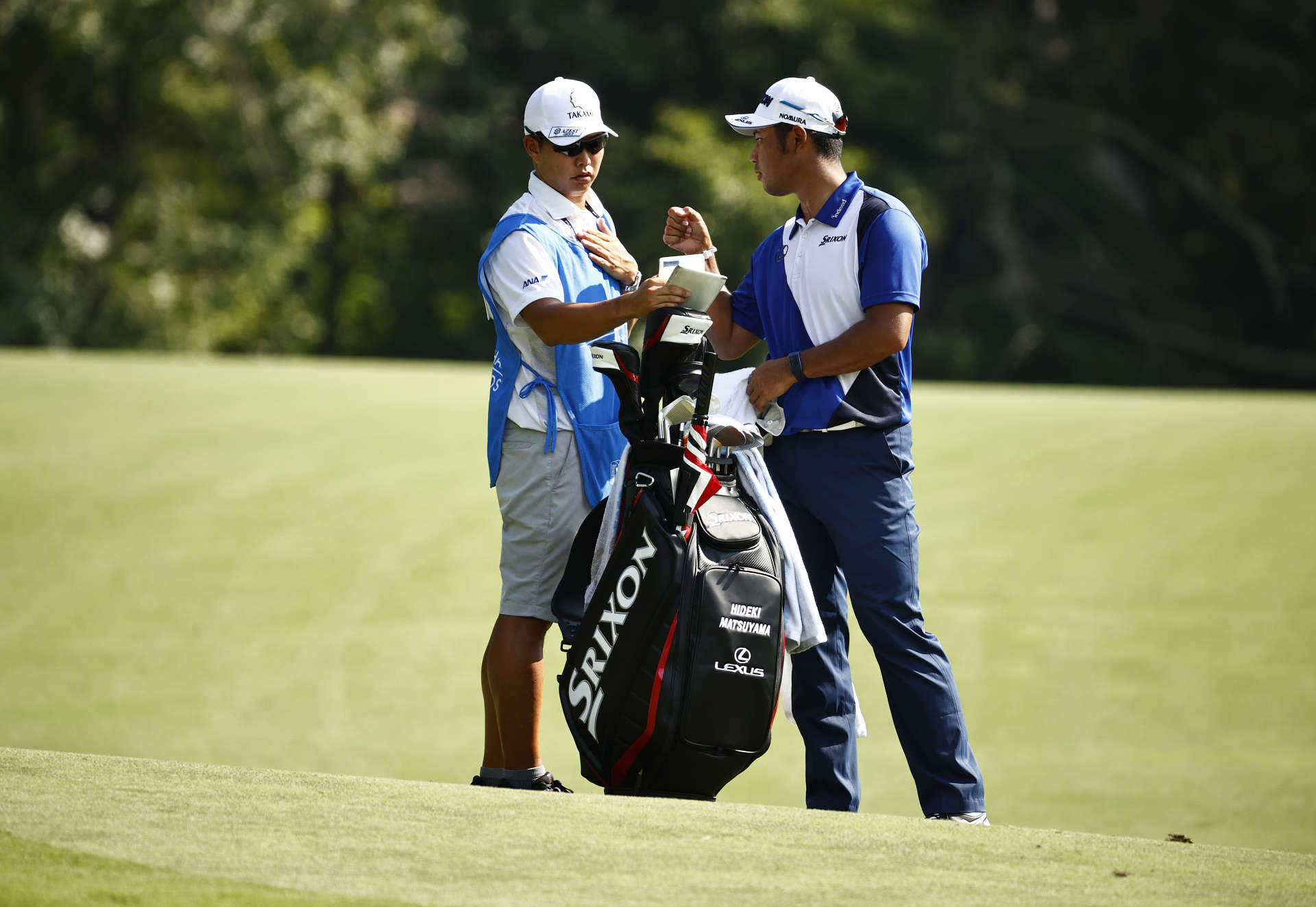 GREENSBORO, NORTH CAROLINA - AUGUST 12: Hideki Matsuyama of Japan and caddie Shota Hayafuji wait on the 14th hole during the first round of the Wyndham Championship at Sedgefield Country Club on August 12, 2021 in Greensboro, North Carolina. (Photo by Jared C. Tilton/Getty Images)