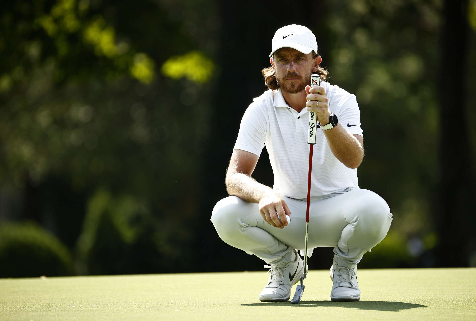 GREENSBORO, NORTH CAROLINA - AUGUST 12: Tommy Fleetwood of England lines up a putt on the 14th green during the first round of the Wyndham Championship at Sedgefield Country Club on August 12, 2021 in Greensboro, North Carolina. (Photo by Jared C. Tilton/Getty Images)