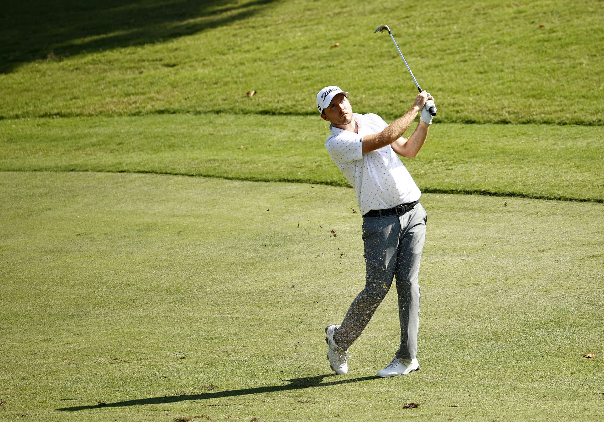 GREENSBORO, NORTH CAROLINA - AUGUST 13: Russell Henley of the United States plays an approach shot on the 17th hole during the second round of the Wyndham Championship at Sedgefield Country Club on August 13, 2021 in Greensboro, North Carolina. (Photo by Jared C. Tilton/Getty Images)