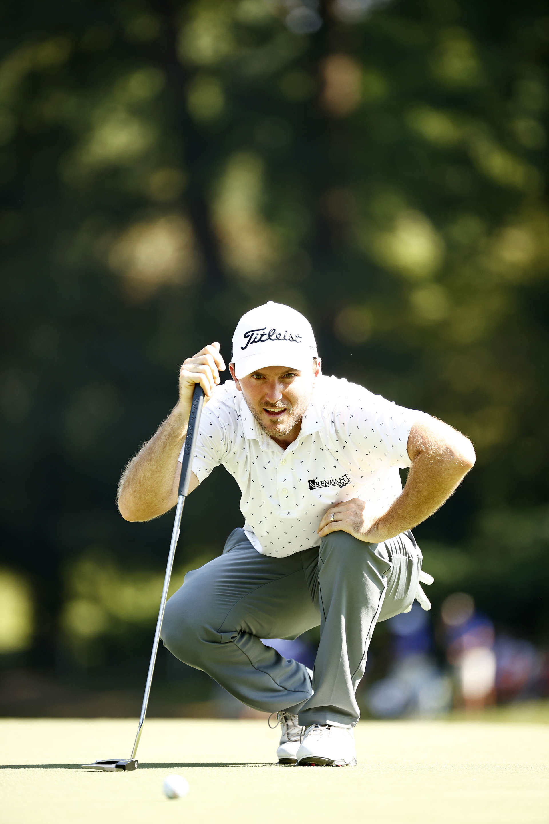 GREENSBORO, NORTH CAROLINA - AUGUST 13: Russell Henley of the United States lines up a putt for birdie on the 17th green during the second round of the Wyndham Championship at Sedgefield Country Club on August 13, 2021 in Greensboro, North Carolina. (Photo by Jared C. Tilton/Getty Images)