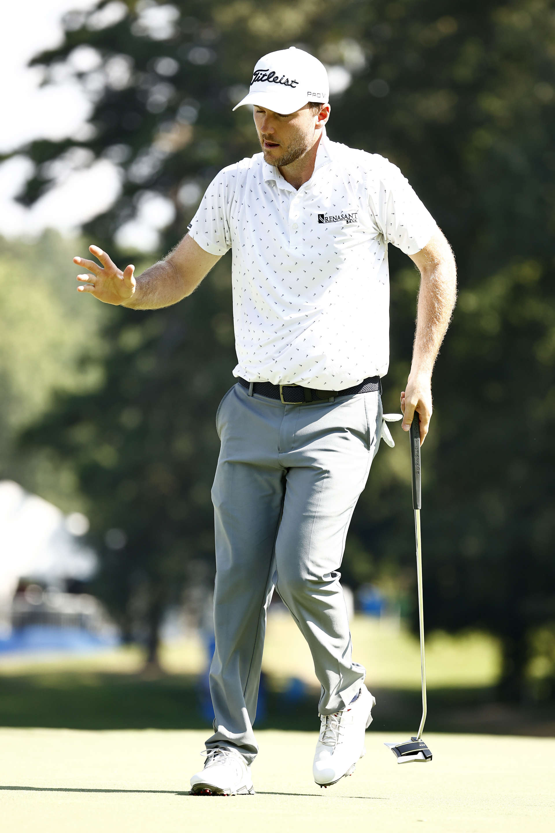 GREENSBORO, NORTH CAROLINA - AUGUST 13: Russell Henley of the United States waves after putting for birdie on the 17th green during the second round of the Wyndham Championship at Sedgefield Country Club on August 13, 2021 in Greensboro, North Carolina. (Photo by Jared C. Tilton/Getty Images)