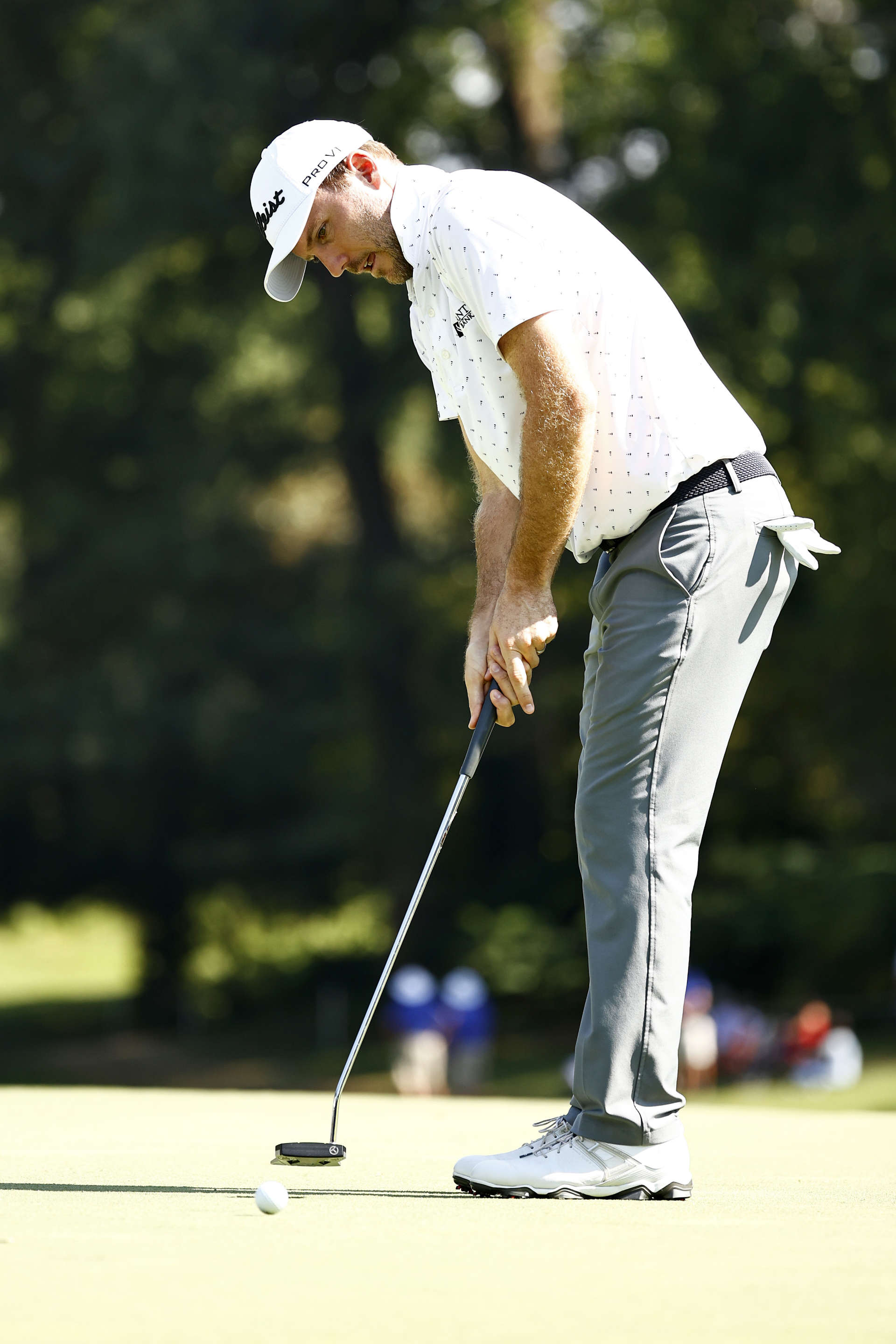 GREENSBORO, NORTH CAROLINA - AUGUST 13: Russell Henley of the United States putts for birdie on the 17th green during the second round of the Wyndham Championship at Sedgefield Country Club on August 13, 2021 in Greensboro, North Carolina. (Photo by Jared C. Tilton/Getty Images)