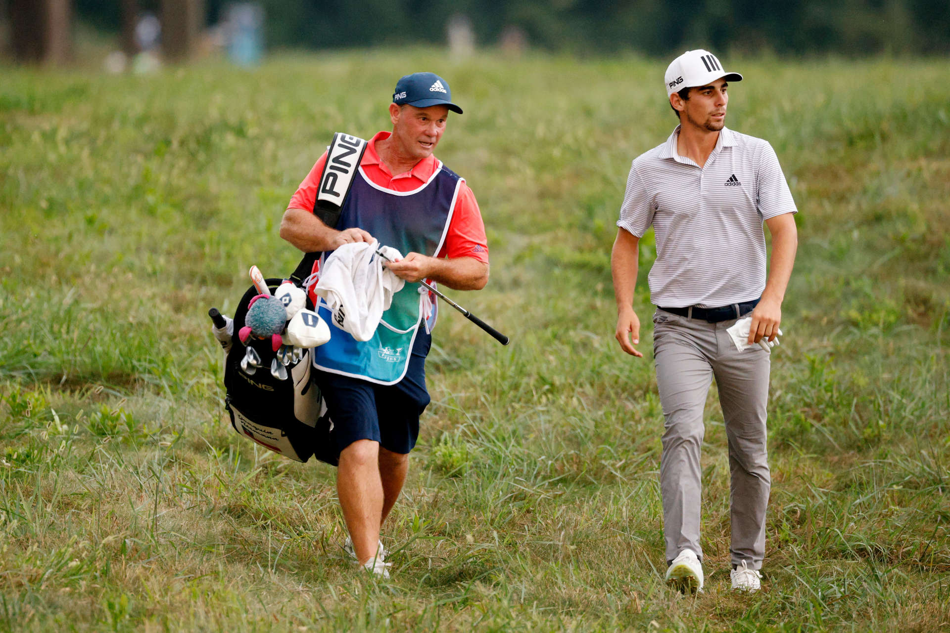 OWINGS MILLS, MARYLAND - AUGUST 27: Joaquin Niemann of Chile walks with his caddie on the 16th hole during the second round of the BMW Championship at Caves Valley Golf Club on August 27, 2021 in Owings Mills, Maryland. (Photo by Cliff Hawkins/Getty Images)