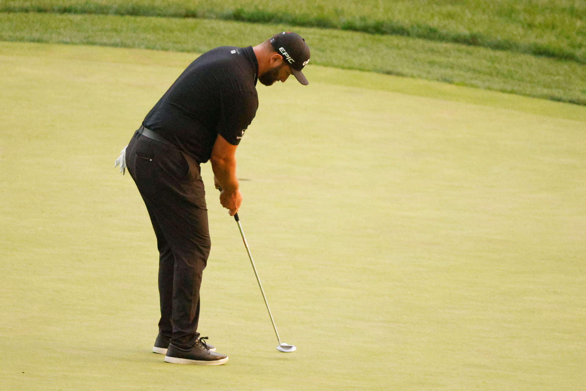 OWINGS MILLS, MARYLAND - AUGUST 27: Jon Rahm of Spain putts on the 15th green during the second round of the BMW Championship at Caves Valley Golf Club on August 27, 2021 in Owings Mills, Maryland. (Photo by Cliff Hawkins/Getty Images)