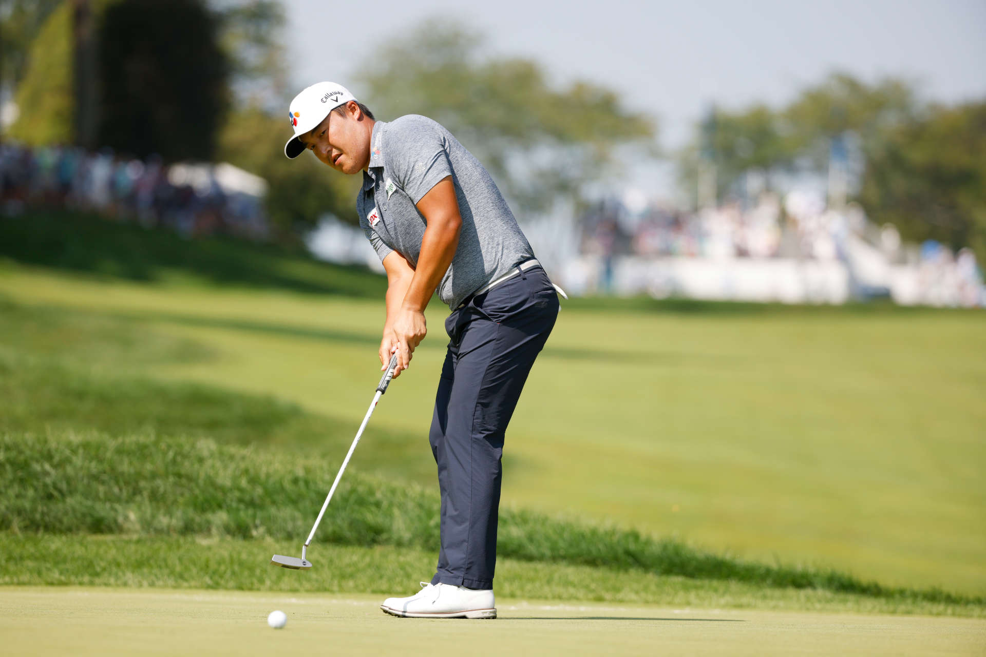 OWINGS MILLS, MARYLAND - AUGUST 27: Kyoung-Hoon Lee of South Korea putts on the first green during the second round of the BMW Championship at Caves Valley Golf Club on August 27, 2021 in Owings Mills, Maryland. (Photo by Cliff Hawkins/Getty Images)