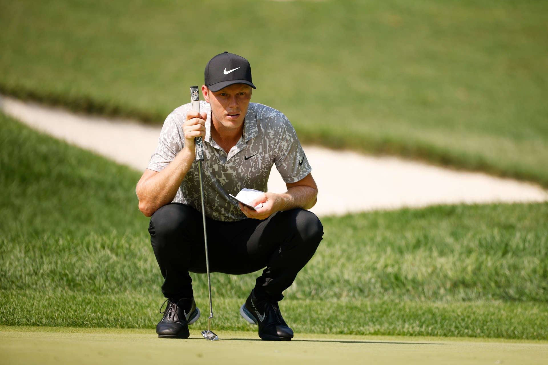 OWINGS MILLS, MARYLAND - AUGUST 27: Cameron Davis of Australia lines up a putt on the first green during the second round of the BMW Championship at Caves Valley Golf Club on August 27, 2021 in Owings Mills, Maryland. (Photo by Cliff Hawkins/Getty Images)