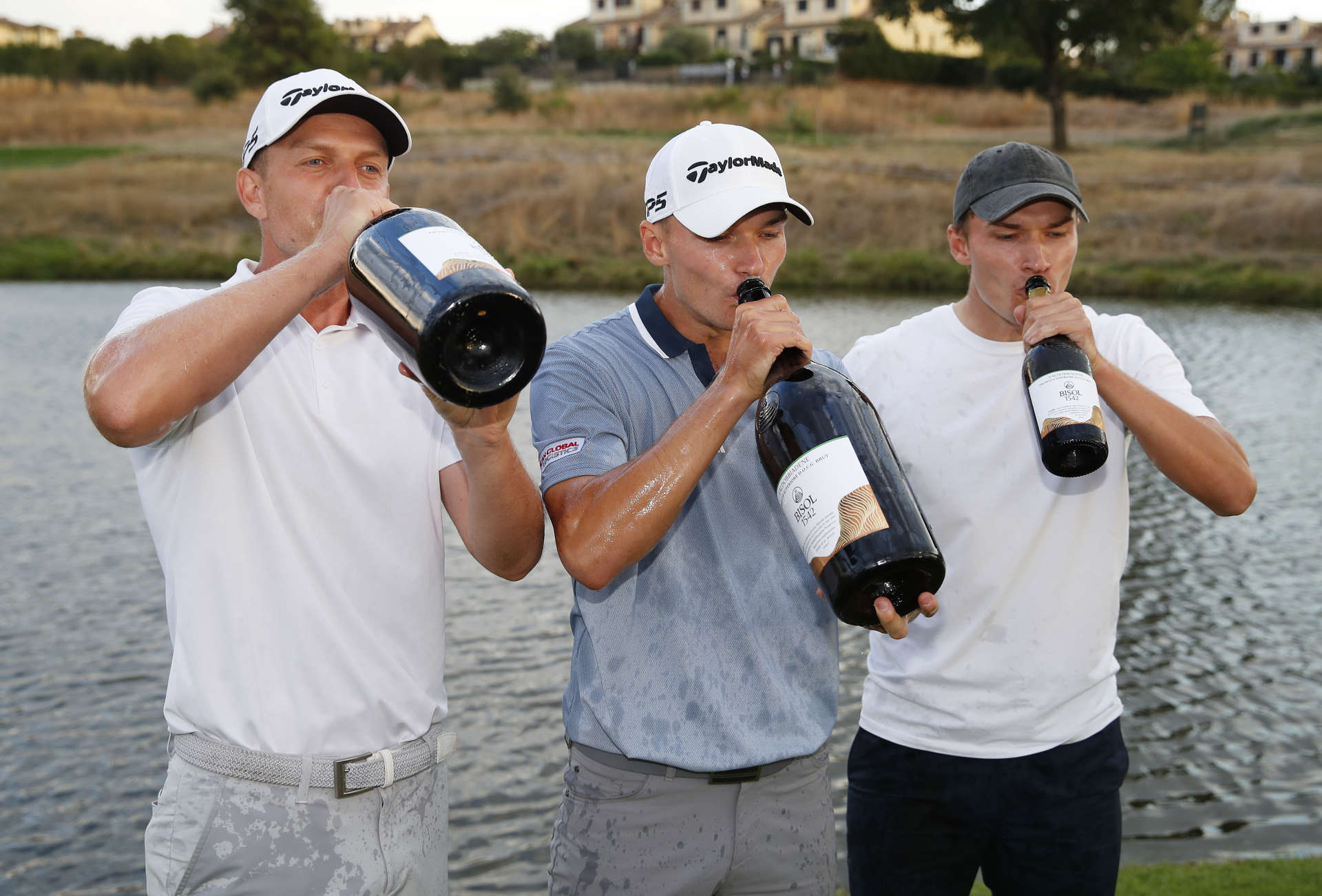 ROME, ITALY - SEPTEMBER 05: Nicolai Hojgaard of Denmark, his brother Ramus Hojgaard and his caddie Christian Baeck celebrate victory together after Day Four of The Italian Open at Marco Simone Golf Club on September 05, 2021 in Rome, Italy. (Photo by Luke Walker/Getty Images)