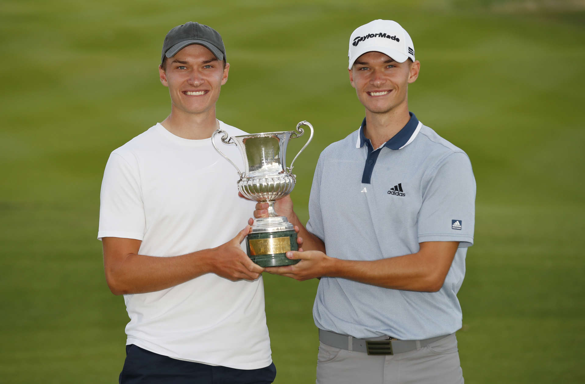 ROME, ITALY - SEPTEMBER 05: Nicolai Hojgaard of Denmark poses for a photo with his brother Ramus Hojgaard of Denmark and the trophy during Day Four of The Italian Open at Marco Simone Golf Club on September 05, 2021 in Rome, Italy. (Photo by Luke Walker/Getty Images)