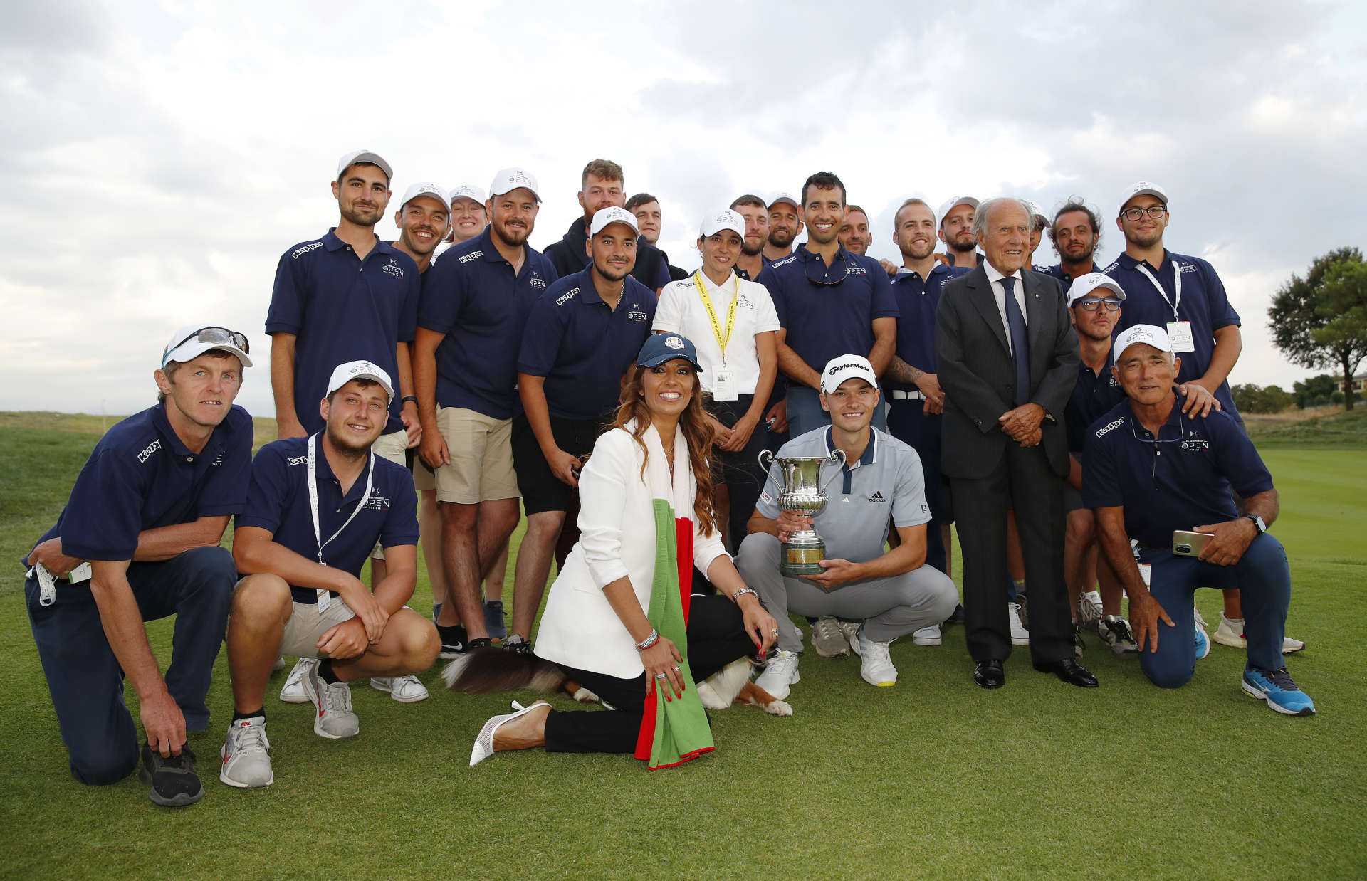 ROME, ITALY - SEPTEMBER 05: Nicolai Hojgaard of Denmark poses for a photo with the trophy and the marshals after Day Four of The Italian Open at Marco Simone Golf Club on September 05, 2021 in Rome, Italy. (Photo by Luke Walker/Getty Images)