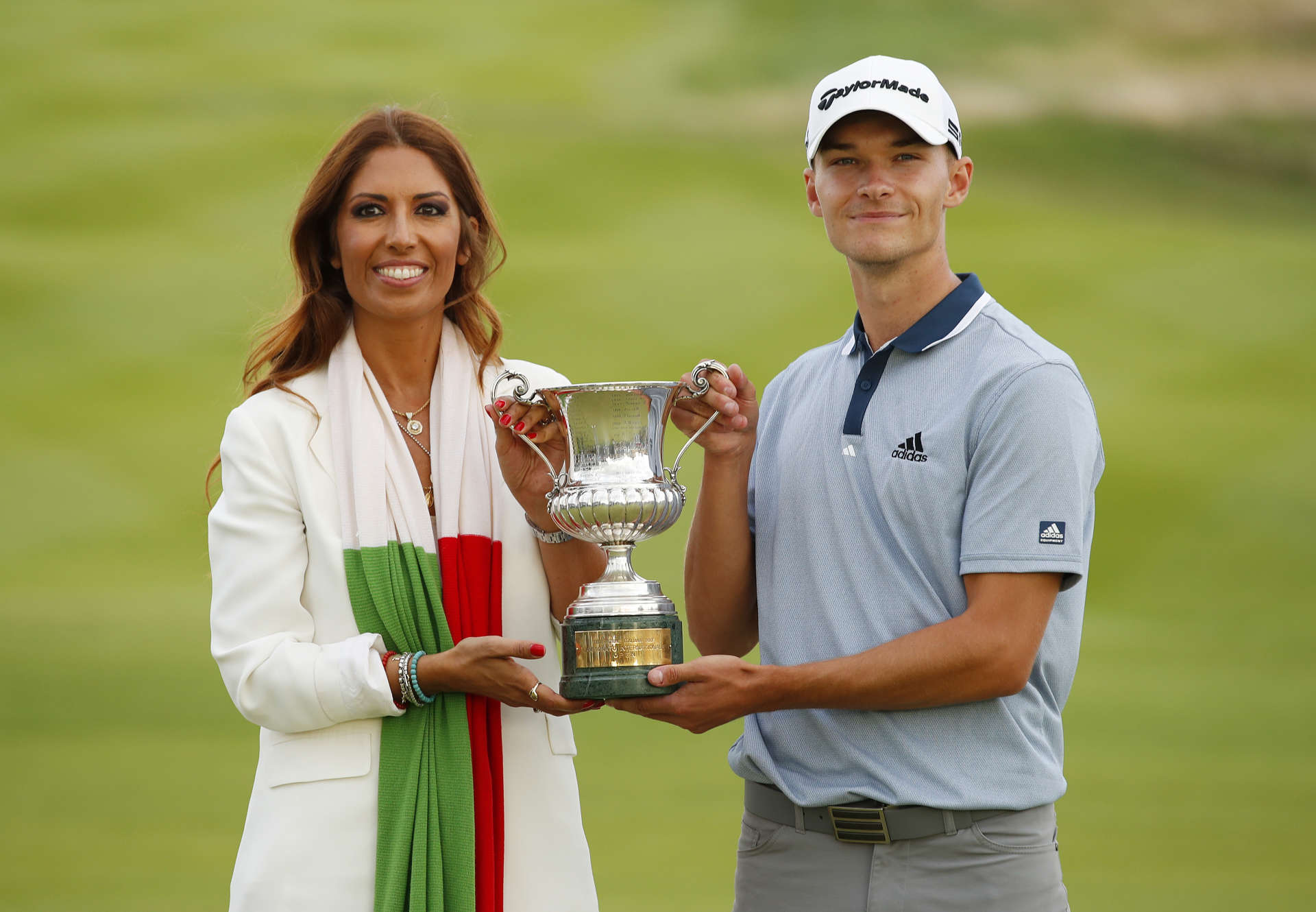 ROME, ITALY - SEPTEMBER 05: Nicolai Hojgaard of Denmark poses for a photo with the trophy and Lavinia Biagiotti, Presidente del Marco Simone Golf & Country Club after Day Four of The Italian Open at Marco Simone Golf Club on September 05, 2021 in Rome, Italy. (Photo by Luke Walker/Getty Images)