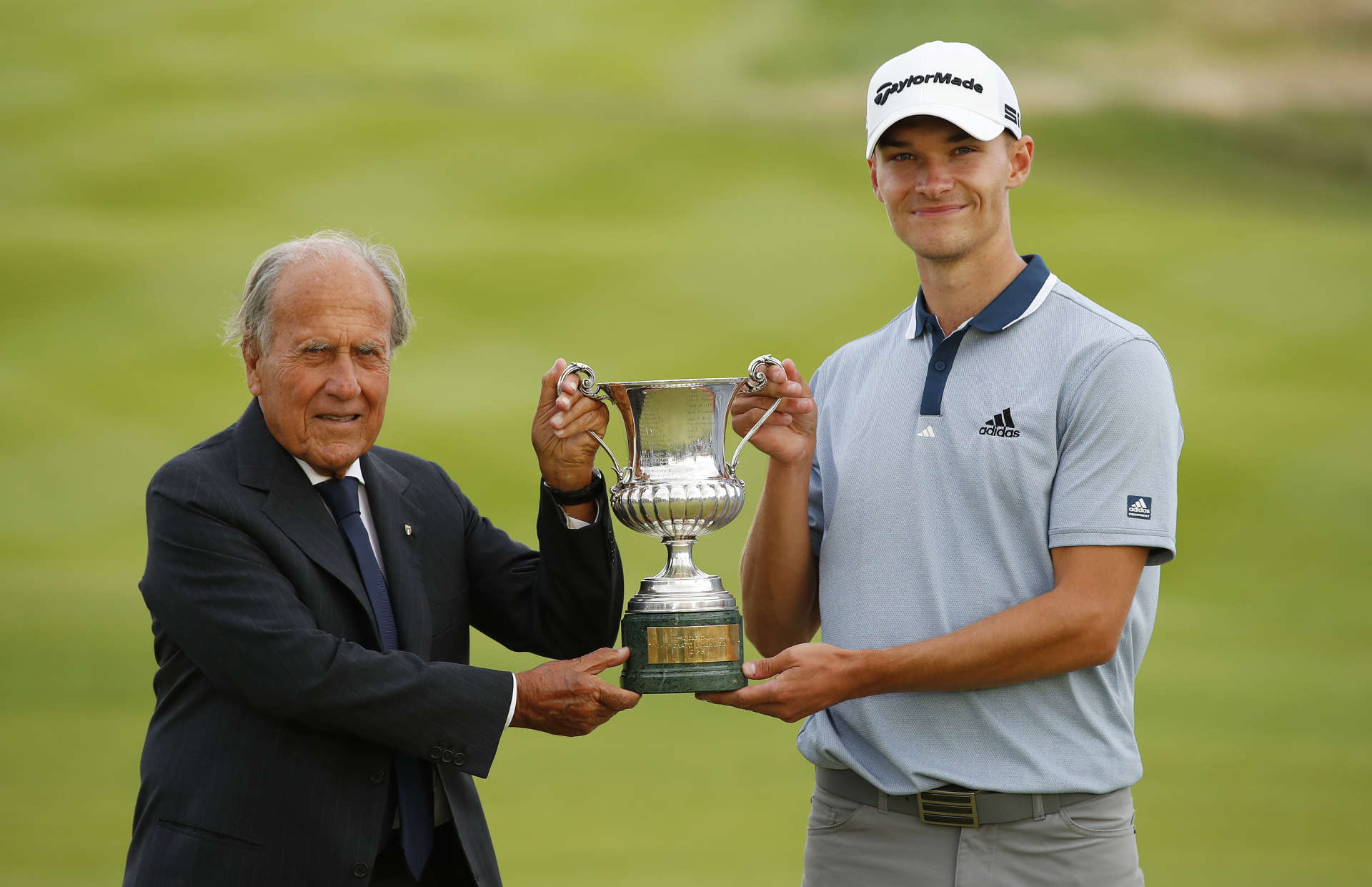 ROME, ITALY - SEPTEMBER 05: Nicolai Hojgaard of Denmark poses for a photo with the trophy and Franco Chimenti, Presidente della Federazione Italiana Golf after Day Four of The Italian Open at Marco Simone Golf Club on September 05, 2021 in Rome, Italy. (Photo by Luke Walker/Getty Images)