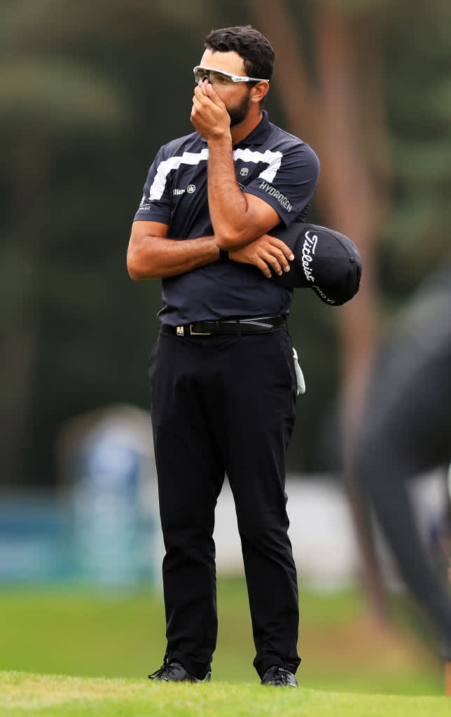 VIRGINIA WATER, ENGLAND - SEPTEMBER 12: Francesco Laporta of Italy looks on, after his shot on the 13th hit his coach Pietro Consenza during Day Four of The BMW PGA Championship at Wentworth Golf Club on September 12, 2021 in Virginia Water, England. (Photo by Richard Heathcote/Getty Images)