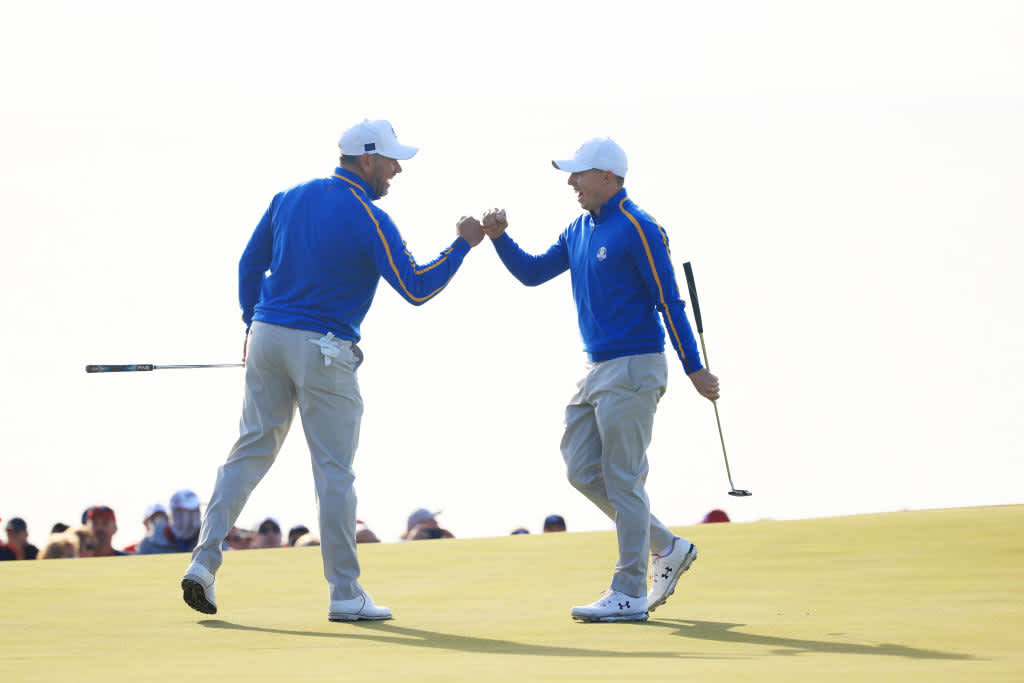 KOHLER, WISCONSIN - SEPTEMBER 24: Lee Westwood of England and team Europe (L) and Matthew Fitzpatrick of England and team Europe react during Friday Morning Foursome Matches of the 43rd Ryder Cup at Whistling Straits on September 24, 2021 in Kohler, Wisconsin. (Photo by Mike Ehrmann/Getty Images)