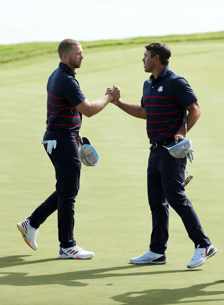 KOHLER, WISCONSIN - SEPTEMBER 24: Daniel Berger of team United States (L) and Brooks Koepka of team United States shake hands during Friday Morning Foursome Matches of the 43rd Ryder Cup at Whistling Straits on September 24, 2021 in Kohler, Wisconsin. (Photo by Patrick Smith/Getty Images)
