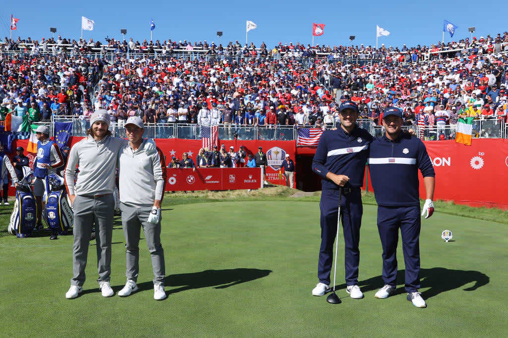 KOHLER, WISCONSIN - SEPTEMBER 25: (L-R) Tommy Fleetwood of England and team Europe, Viktor Hovland of Norway and team Europe, Scottie Scheffler of team United States, and Bryson DeChambeau of team United States pose for photos on the first tee during Saturday Afternoon Fourball Matches of the 43rd Ryder Cup at Whistling Straits on September 25, 2021 in Kohler, Wisconsin. (Photo by Andrew Redington/Getty Images)