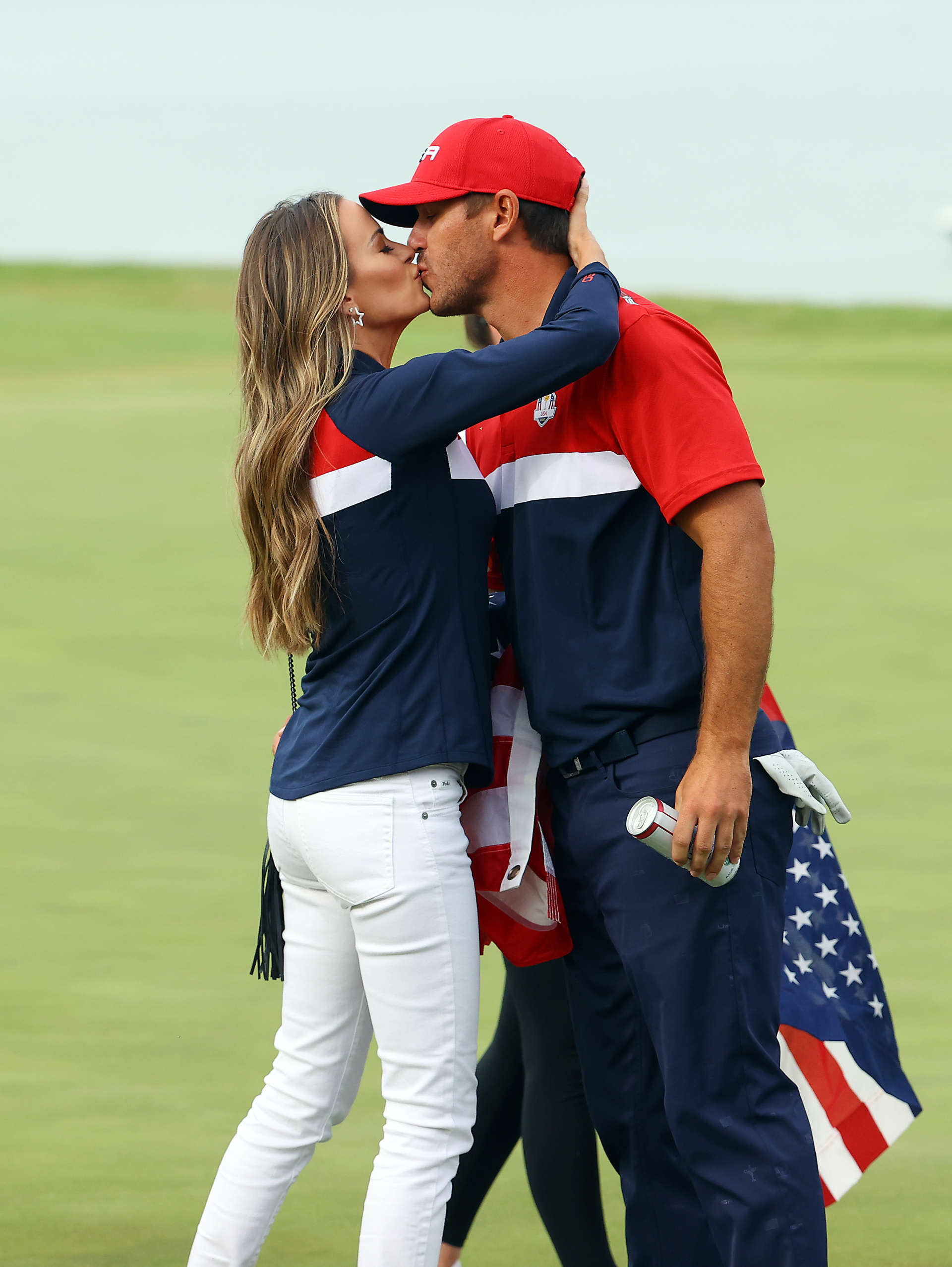 KOHLER, WISCONSIN - SEPTEMBER 26: Brooks Koepka of team United States celebrates with wife Jena Sims after winning his match on the 17th green during Sunday Singles Matches of the 43rd Ryder Cup at Whistling Straits on September 26, 2021 in Kohler, Wisconsin. (Photo by Andrew Redington/Getty Images)
