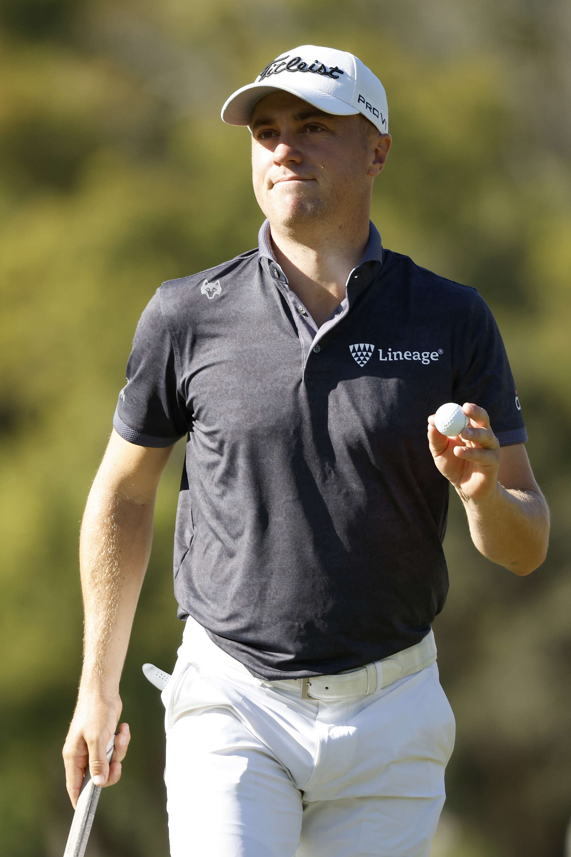 PALM HARBOR, FLORIDA - MARCH 17: Justin Thomas of the United States waves on the 16th green during the first round of the Valspar Championship on the Copperhead Course at Innisbrook Resort and Golf Club on March 17, 2022 in Palm Harbor, Florida. (Photo by Cliff Hawkins/Getty Images)