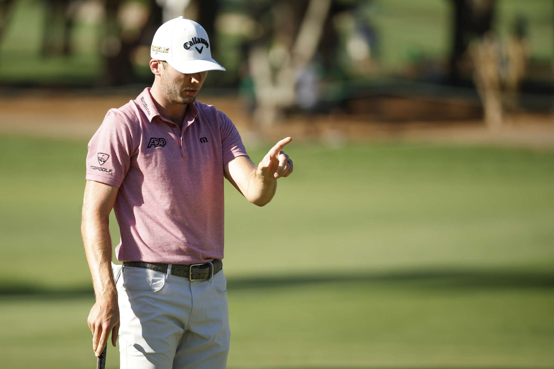 PALM HARBOR, FLORIDA - MARCH 17: Sam Burns of the United States lines up a putt on the 16th green during the first round of the Valspar Championship on the Copperhead Course at Innisbrook Resort and Golf Club on March 17, 2022 in Palm Harbor, Florida. (Photo by Cliff Hawkins/Getty Images)