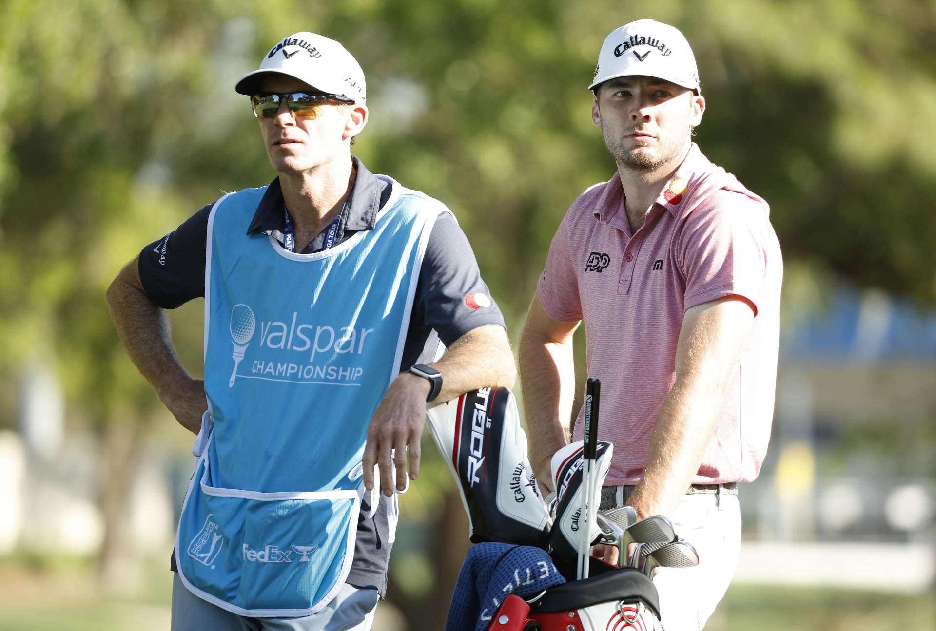 PALM HARBOR, FLORIDA - MARCH 17: Sam Burns of the United States waits with his caddie Travis Perkins on the 17th tee during the first round of the Valspar Championship on the Copperhead Course at Innisbrook Resort and Golf Club on March 17, 2022 in Palm Harbor, Florida. (Photo by Cliff Hawkins/Getty Images)