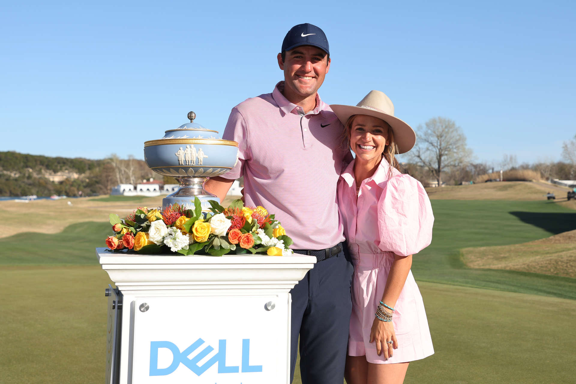 AUSTIN, TEXAS - MARCH 27: Scottie Scheffler of the United States poses with his wife Meredith Scheffler and the Walter Hagen Cup after defeating Kevin Kisner of the United States (not pictured) 4&3 in thier finals match to win the World Golf Championships-Dell Technologies Match Play at Austin Country Club on March 27, 2022 in Austin, Texas. (Photo by Gregory Shamus/Getty Images)