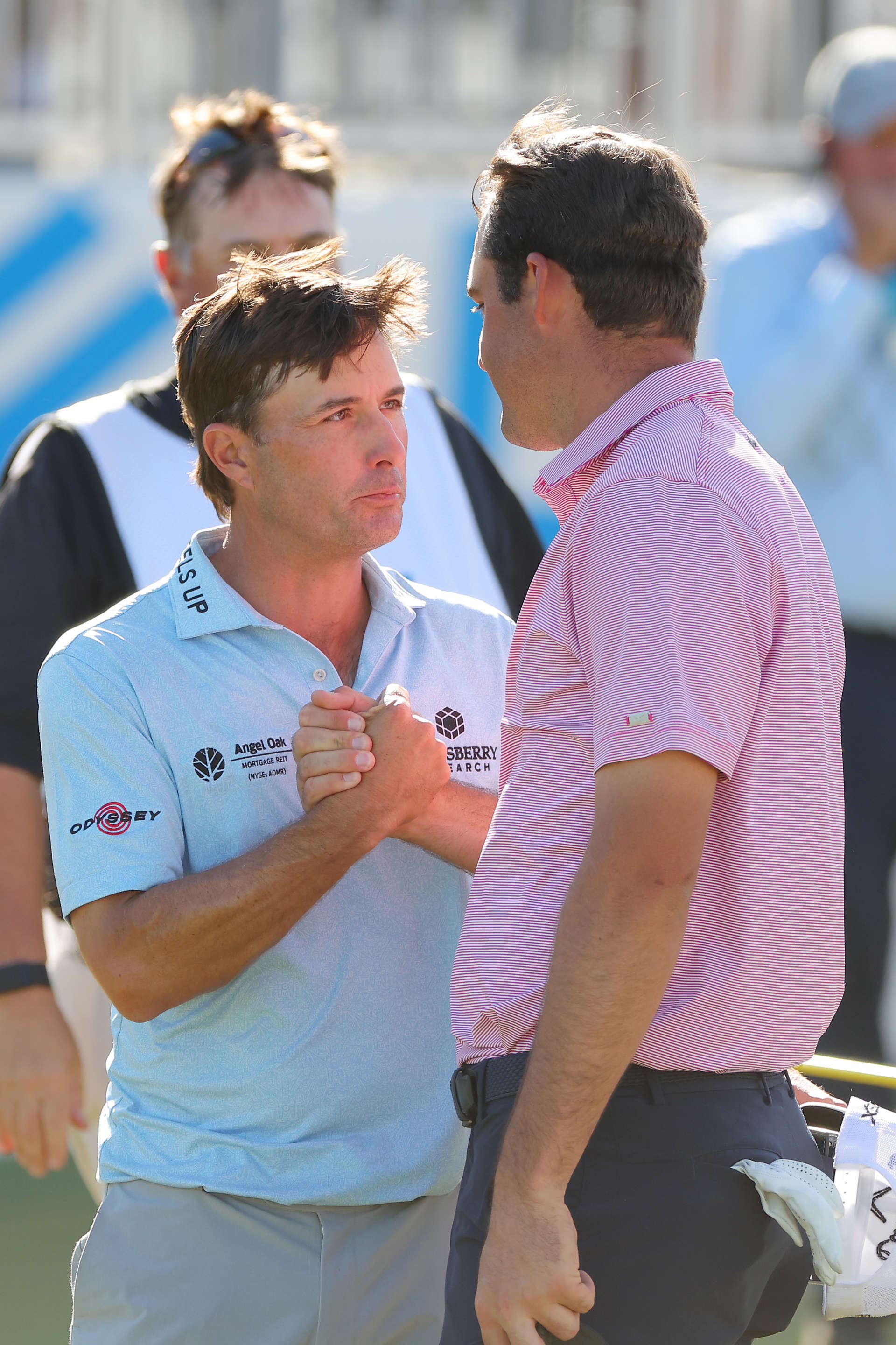 AUSTIN, TEXAS - MARCH 27: Scottie Scheffler of the United States shakes hands with Kevin Kisner of the United States on the 15th green after defeating him 4&3 to in their finals match to win the World Golf Championships-Dell Technologies Match Play at Austin Country Club on March 27, 2022 in Austin, Texas. (Photo by Kevin C. Cox/Getty Images)
