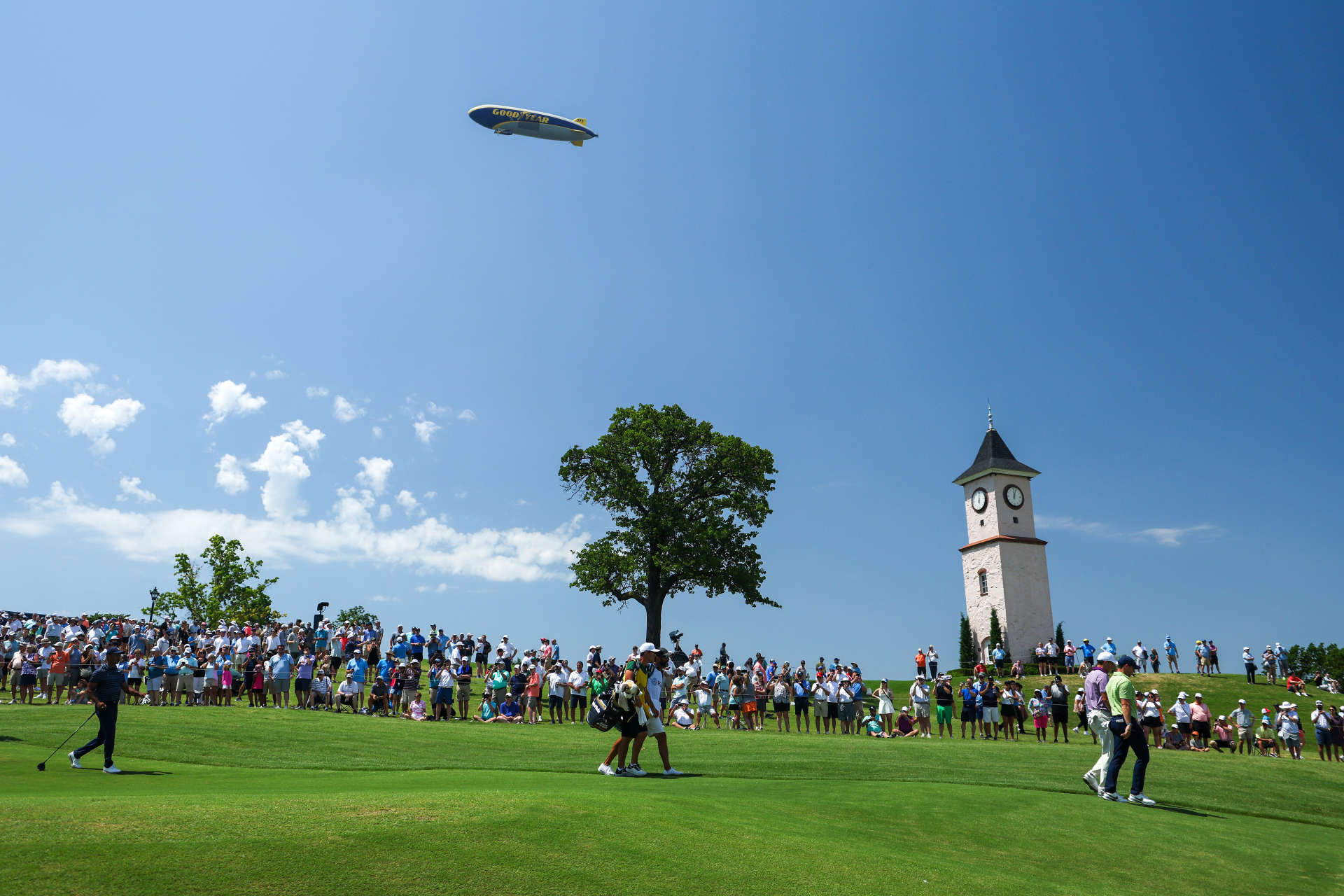 TULSA, OKLAHOMA - MAY 19: Tiger Woods of the United States, Jordan Spieth of the United States and Rory McIlroy of Northern Ireland walk down the fifth hole during the first round of the 2022 PGA Championship at Southern Hills Country Club on May 19, 2022 in Tulsa, Oklahoma. (Photo by Richard Heathcote/Getty Images)