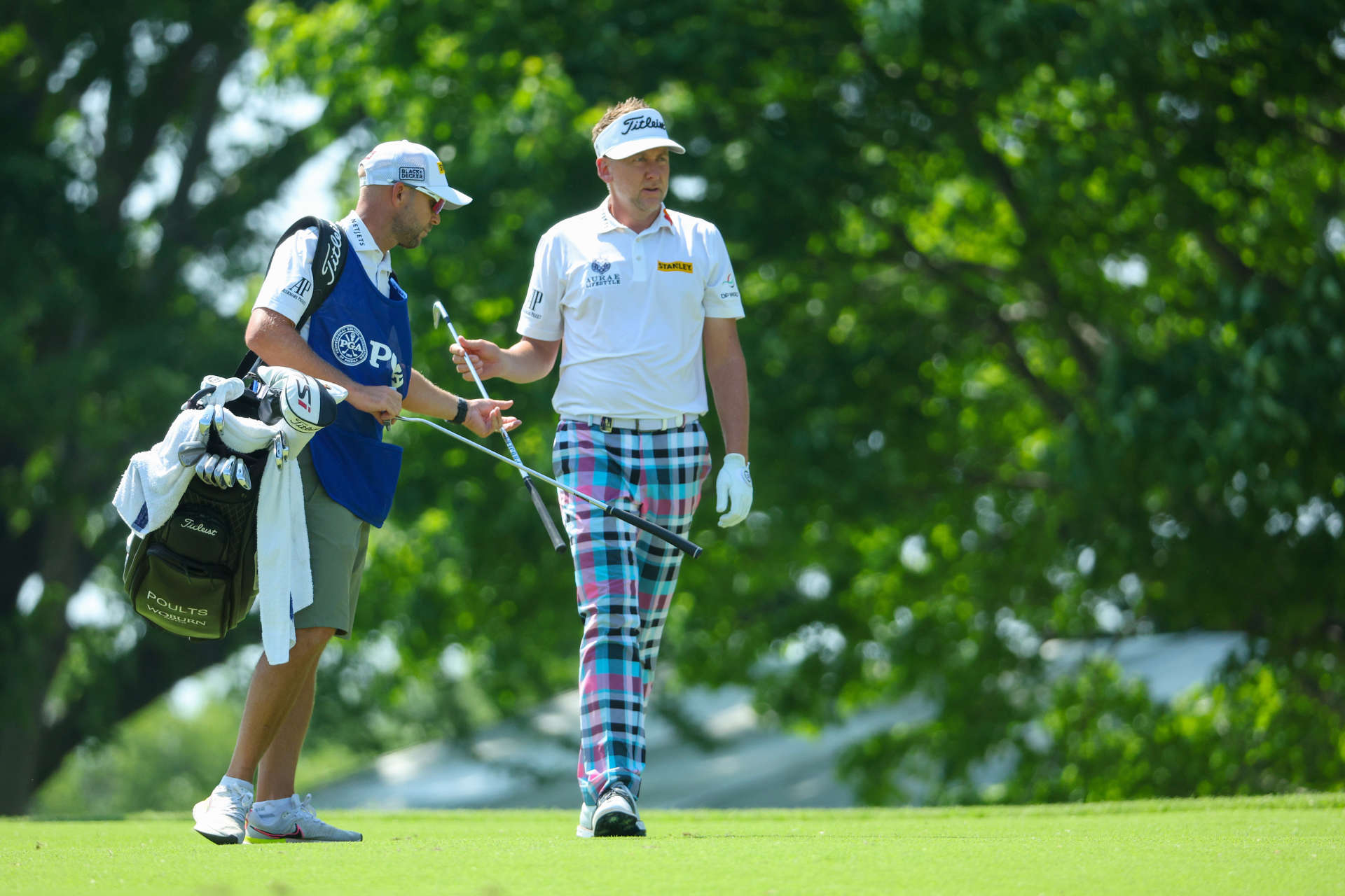 TULSA, OKLAHOMA - MAY 19: Ian Poulter of England and his caddie James Walton o the seventh hole during the first round of the 2022 PGA Championship at Southern Hills Country Club on May 19, 2022 in Tulsa, Oklahoma. (Photo by Andrew Redington/Getty Images)