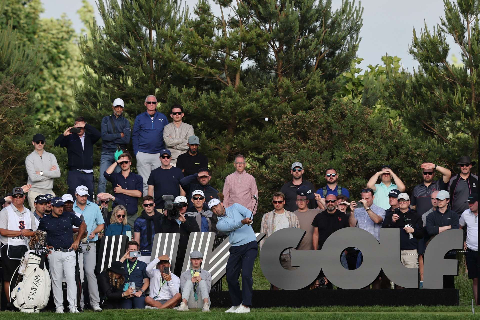 South African golfer Charl Schwartzel plays a shot on the 17th hole during the third and final day of the LIV Golf Invitational Series event at The Centurion Club in St Albans, north of London, on June 11, 2022. - The LIV Golf Invitational London, the launch event of a lucrative and divisive series that is rocking the sport reaches it's conclusion. The $25 million event in St Albans -- the biggest prize pot in history -- is the first of eight tournaments this year bankrolled by Saudi Arabia's sovereign wealth fund, worth a combined $255 million. (Photo by Adrian DENNIS / AFP) (Photo by ADRIAN DENNIS/AFP via Getty Images)